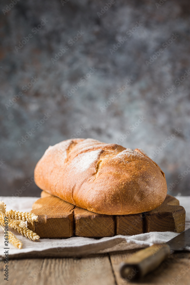 Fresh homemade crisp bread on wooden background. French bread. Bread at leaven. Unleavened bread