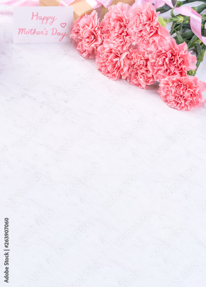 Design concept - Beautiful bunch of carnations on marble white background, top view, copy space, close up, mock up. Mothers day gift idea inspiration. - obrazy, fototapety, plakaty 