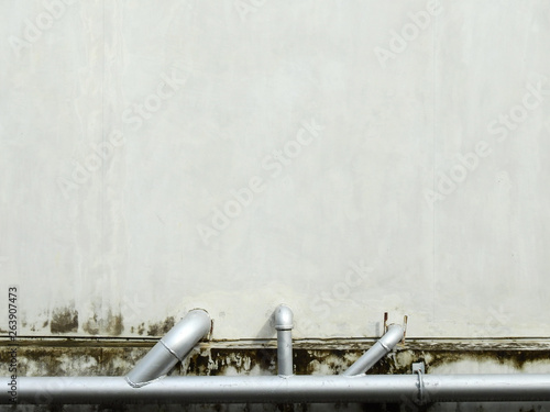 old concrete wall with pipe