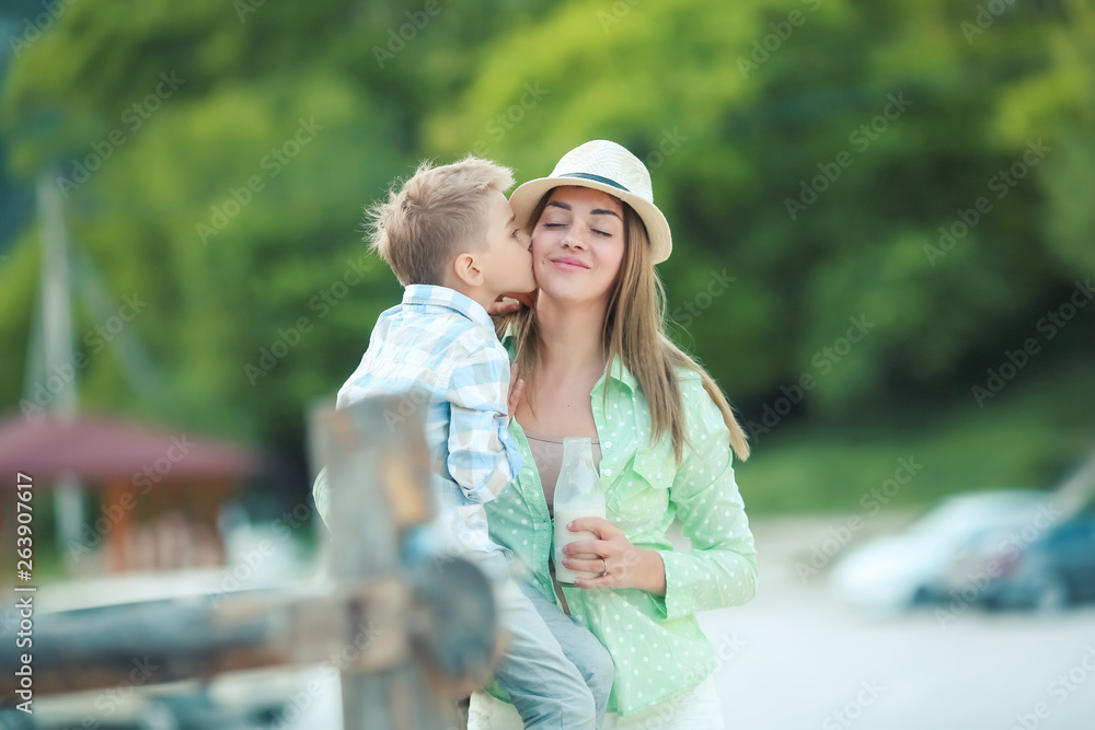 Fototapeta premium Mother and son holding hand in hand