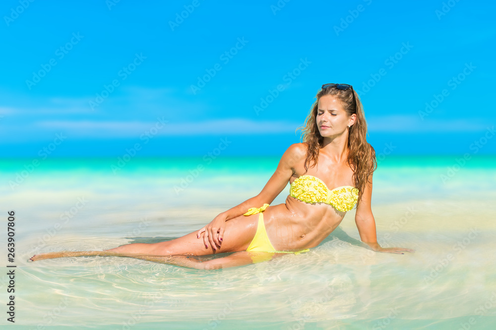 Woman enjoying her holidays on the tropical beach in Thailand