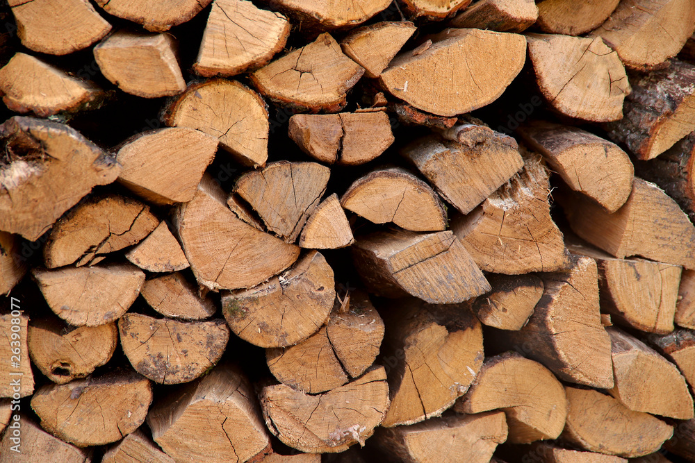 Background texture of stacked dry firewood. Side view, cropped shot, horizontal, close-up. The concept of nature. Background texture of stacked dry firewood. Side view, cropped shot, horizontal, close-up. The concept of nature.