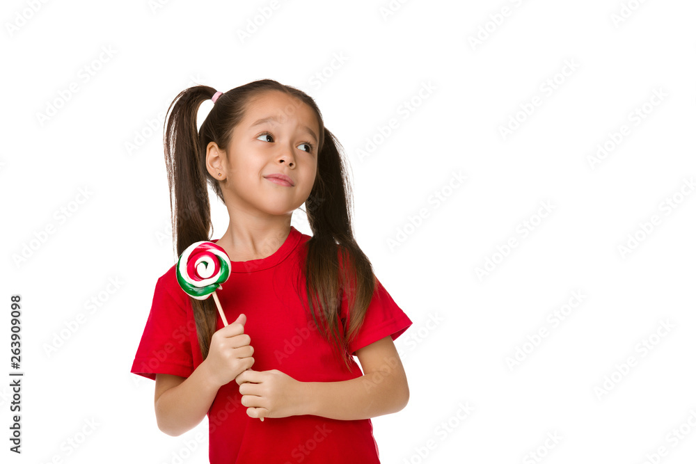 Obraz na plátně Beautiful cute little child girl with sweet candy lollipop isolated on white bac