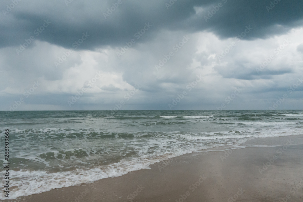 Stormy weather over the ocean on a beach in South Florida.