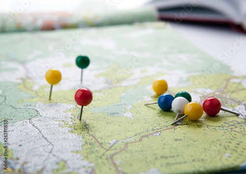 topographic map with colored needles pushpins close up