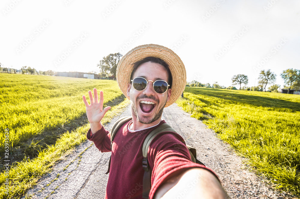 Man taking a selfie on a nature background Stock Photo | Adobe Stock