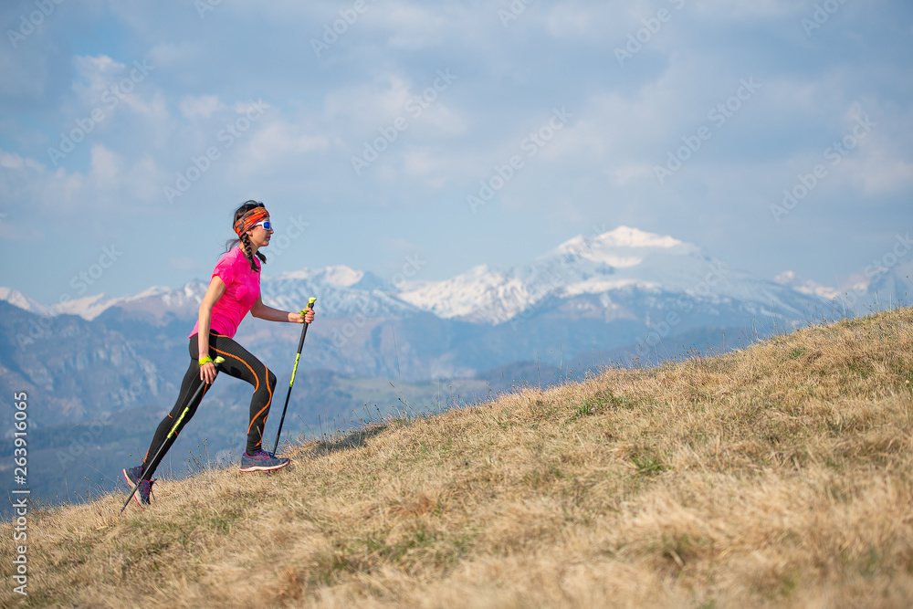 Young athlete running in the mountains and skyrunning during a workout Young athlete running in the mountains and skyrunning during a workout