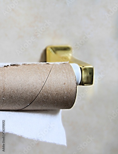 empty toilet paper with holder on the wall no people stock photo