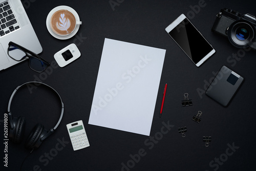 Graphic design and photographer workspace. Flat lay and top view with office supplies and copy space on black background. SOHO or freelancer lifestyle concept .