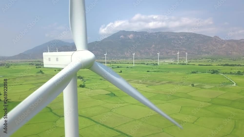 Wind power turbines aerial landscape. Windmill turbine generating clean renewable energy in green agricultural field drone view. Wind energy station. Ecology and nature conservation. Wind power turbines aerial landscape. Windmill turbine generating clean renewable energy in green agricultural field drone view. Wind energy station. Ecology and nature conservation.