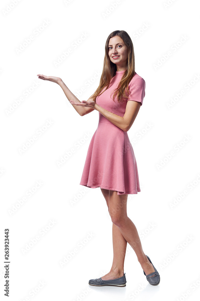 Woman in pink dress holding blank copy space on the palm Woman in pink dress holding blank copy space on the palm