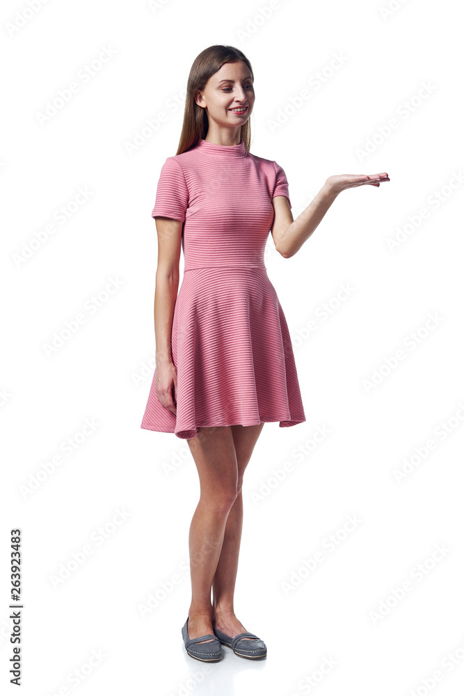 Fototapeta premium Woman in pink dress holding blank copy space on the palm