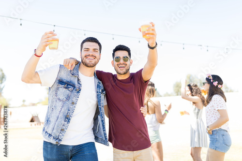 Photography Friends Enjoying Drinks At Weekend Party
