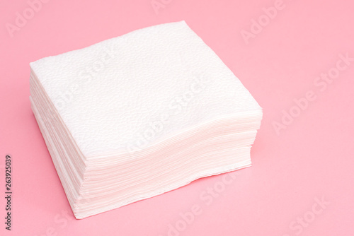 Stack of white square paper napkins