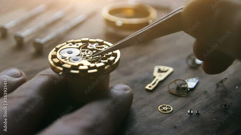 Watchmaker is fixing a wristwatch Watchmaker is fixing a wristwatch