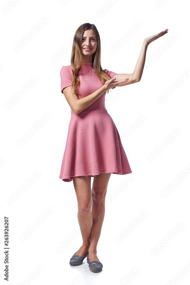 Woman in pink dress showing blank copy space Woman in pink dress showing blank copy space
