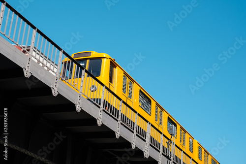 Obraz na plátně The Berlin U-Bahn train (metro train) U1 on elevated railroad bridge outdoor -