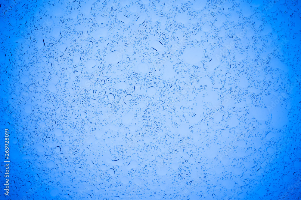Rain droplets on blue glass background, Water drops on blue glass. Rain droplets on blue glass background, Water drops on blue glass.