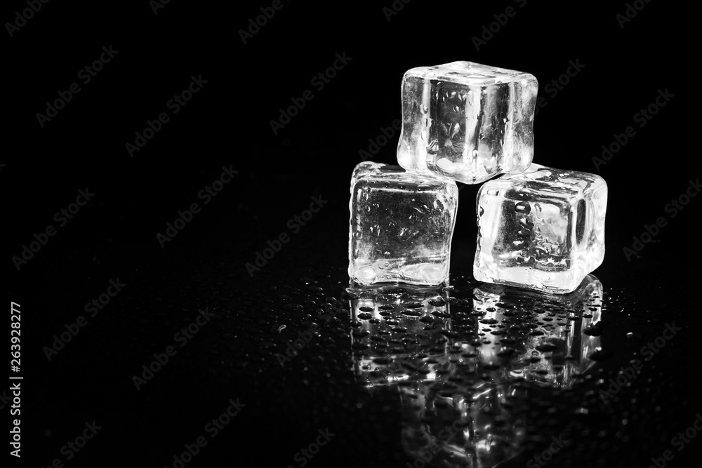 ice cubes reflection on black table background. ice cubes reflection on black table background.