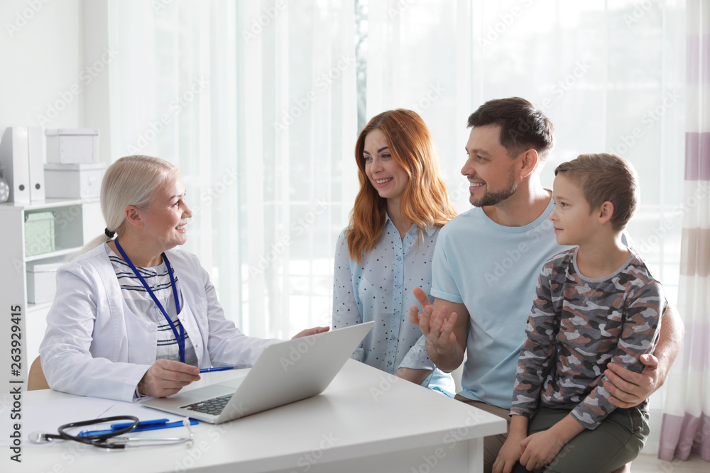 Fototapeta premium Family with child visiting doctor in hospital