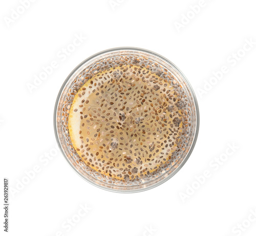 Glass of water with chia seeds on white background, top view
