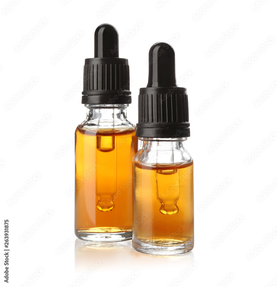 Bottles of essential oil isolated on white Bottles of essential oil isolated on white