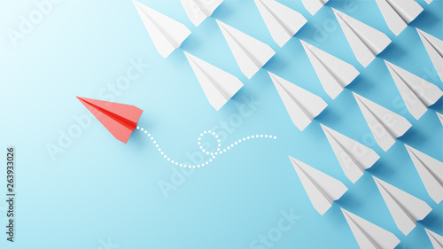 Illustration of leadership concept with red paper plane leading among white on blue background