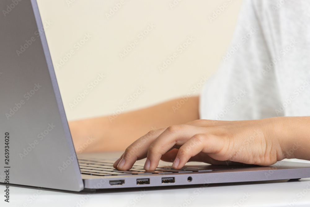 Hands typing on laptop computer keyboard Hands typing on laptop computer keyboard