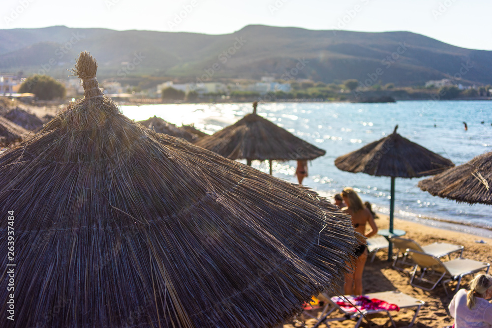 Greece, Crete, August 2018:  People under umbrellas on one of the beach of Crete