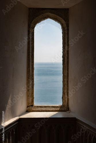 window on the wall overlooking the sea