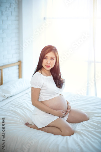 Attractive pregnant asian woman
