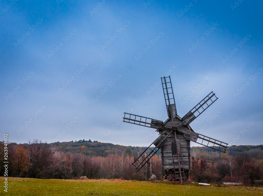 windmill in a field at autumn