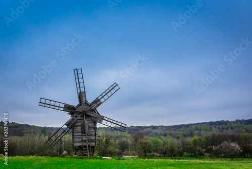 old windmill in a field
