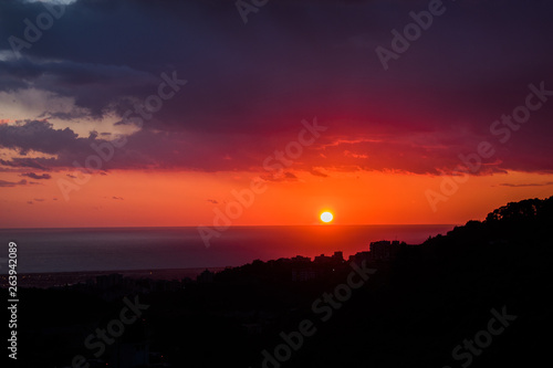 This is a capture of a sunset in Beirut and you can see the orange color formed by the sun and the beautiful horizon photo