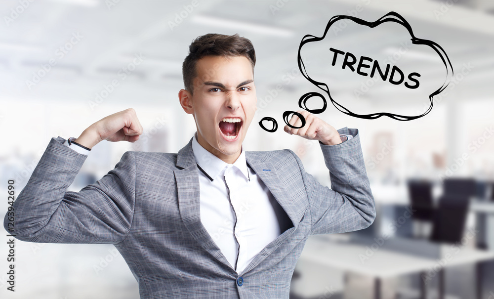 Business, technology, internet and networking concept. Young entrepreneur shouts out a keyword: Trends Business, technology, internet and networking concept. Young entrepreneur shouts out a keyword: Trends