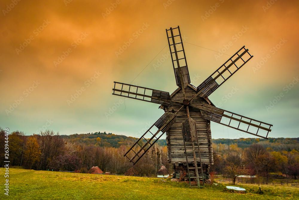windmill in a field at autumn windmill in a field at autumn
