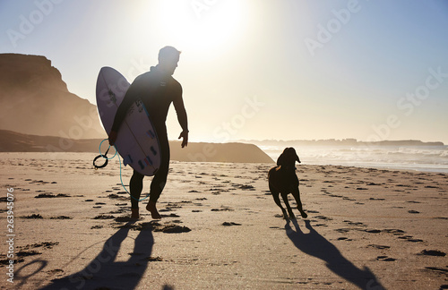 surfer with dog