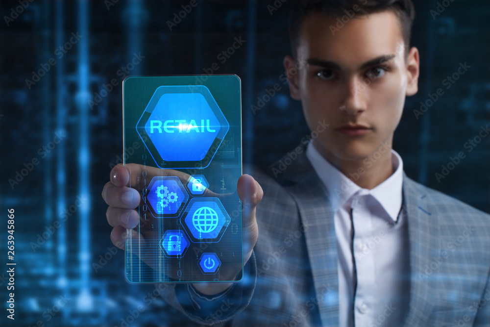 The concept of business, technology, the Internet and the network. A young entrepreneur working on a virtual screen of the future and sees the inscription: Retail The concept of business, technology, the Internet and the network. A young entrepreneur working on a virtual screen of the future and sees the inscription: Retail