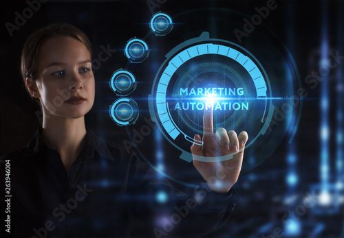 The concept of business, technology, the Internet and the network. A young entrepreneur working on a virtual screen of the future and sees the inscription: Marketing automation