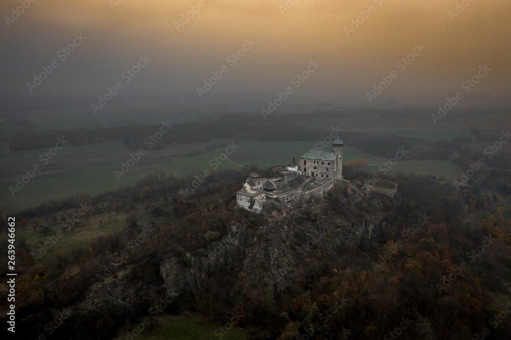 Fototapeta premium Kunětice Mountain sits in a plain, above which it rises 82 meters (305 m above sea level). Geologically, the mountain is a laccolith, dating from the Cenozoic era. Toward the end of the 19th century.