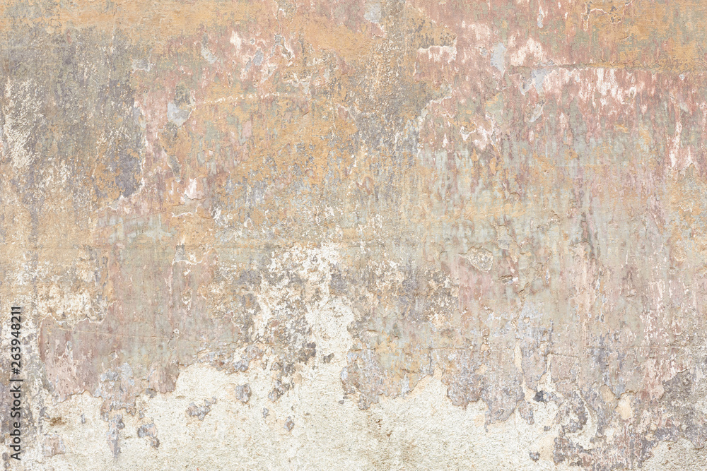 Old chipped and faded wall texture background