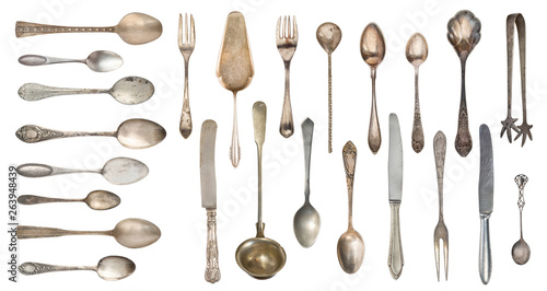 Top view of beautiful vintage silver knife, spoon and fork  isolated on white background. Silverware.