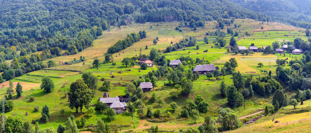 Beautiful picturesque summer landscape in the Carpathian mountains, Husnyi - a village, the Velyky Berezny district, in the Transcarpathian region, Ukraine.