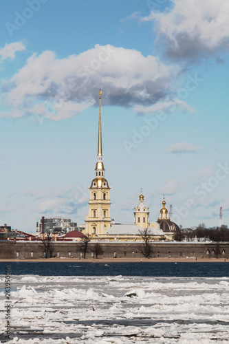 Saint Petersburg, Russia - Peter and Paul fortress first historical building in city. Winter sunny day in spring during ice breakup and ice drift on Neva river. Soft focus.