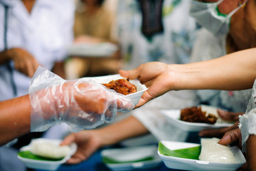 Feeding the hungry to get a taste for the poor Make humanitarian society : concept social contribution : Donate leftover food to hungry people
