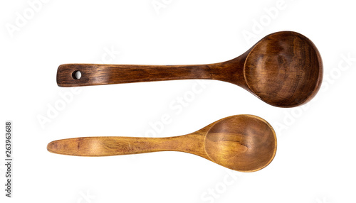 Empty wooden spoons isolated on white background, close up