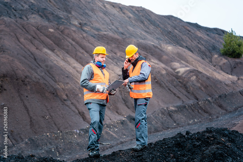 Photos Workers in open-cast mining operation pit