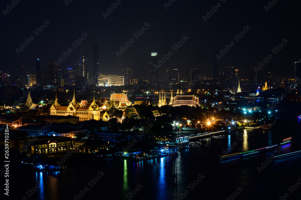 Night Cityscape or landscape view of bangkok thailand with Chao Phraya River.