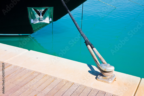 The black bow of a moored boat