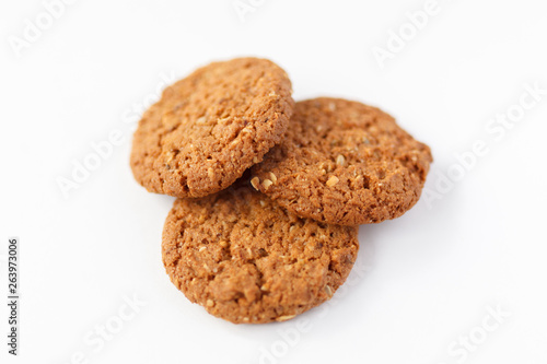 three oat cookies  on white background photo with nuts healthy food  for the diet